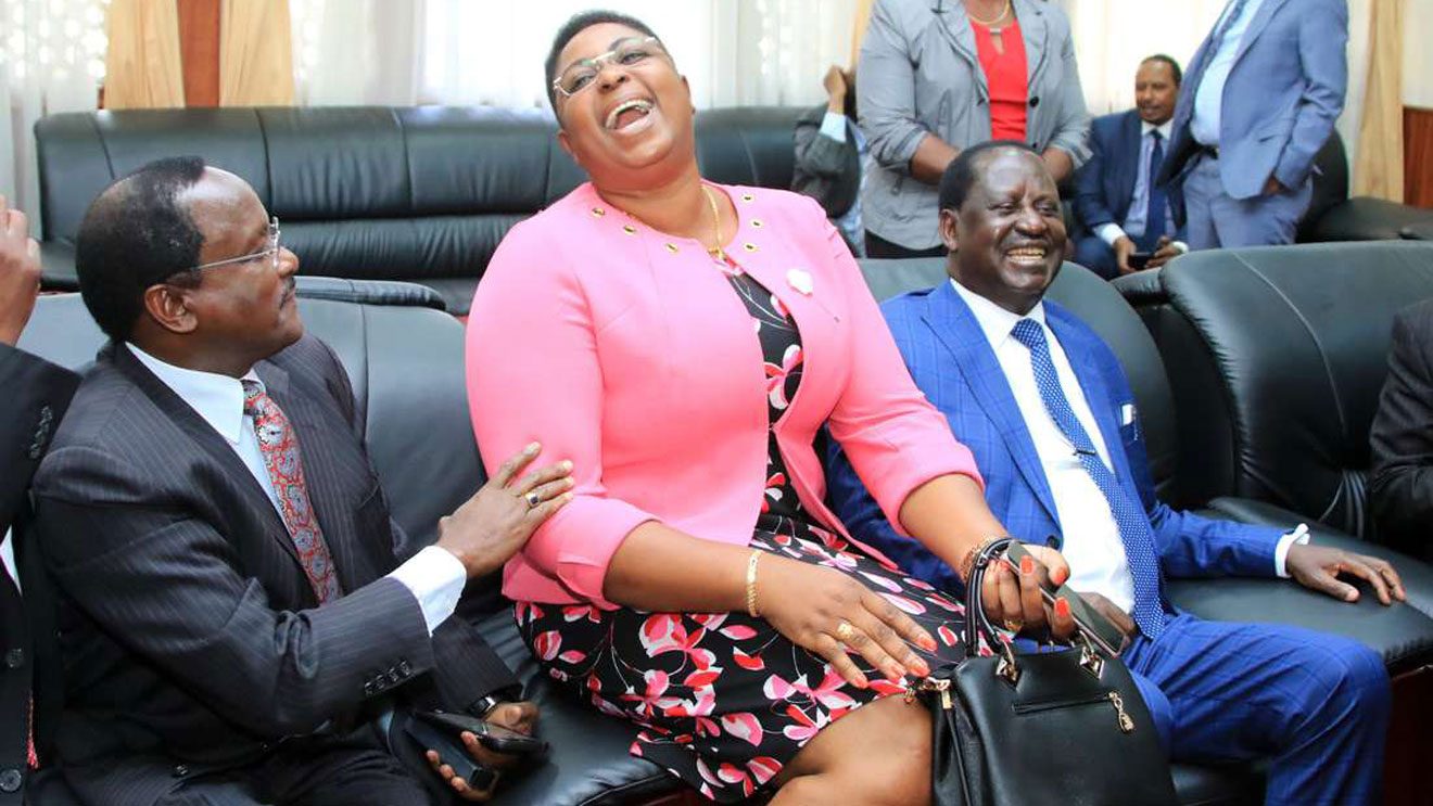 CS Juwa Corrects Raila Over  His Political Prostitution Remark